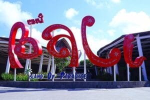 Colorful Bali Island of Paradise sign at Ngurah Rai International Airport, symbolizing the starting point for Bali Airport to Ubud travel.