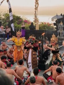 Traditional Kecak dance performance at Uluwatu Temple during sunset, showcasing unique things to do in Bali and Balinese cultural traditions.